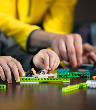Kids building in the Bricksburgh exhibit.