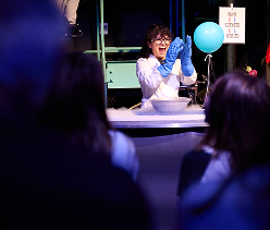 A Science Center staff member performs a demonstration.