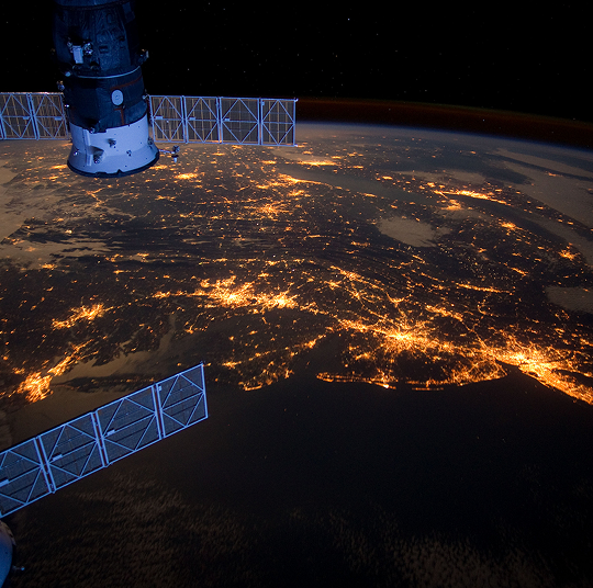 Earth at night as seen from a satellite.