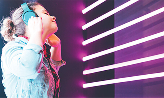 A young girl with headphones.