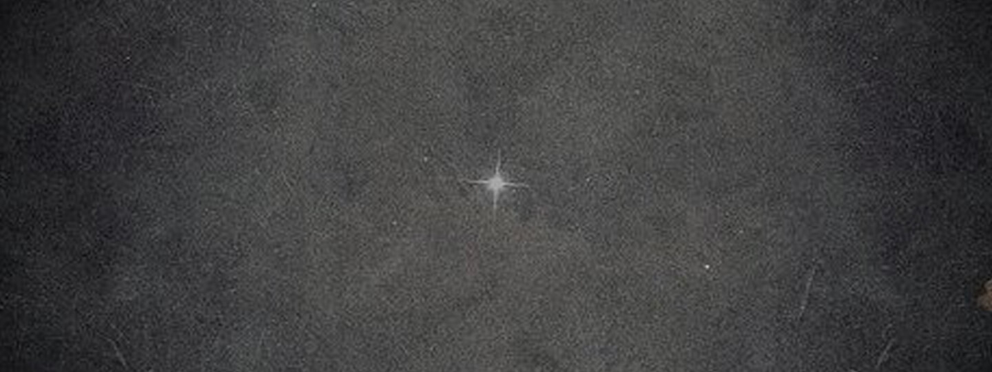 Grainy image of a star.